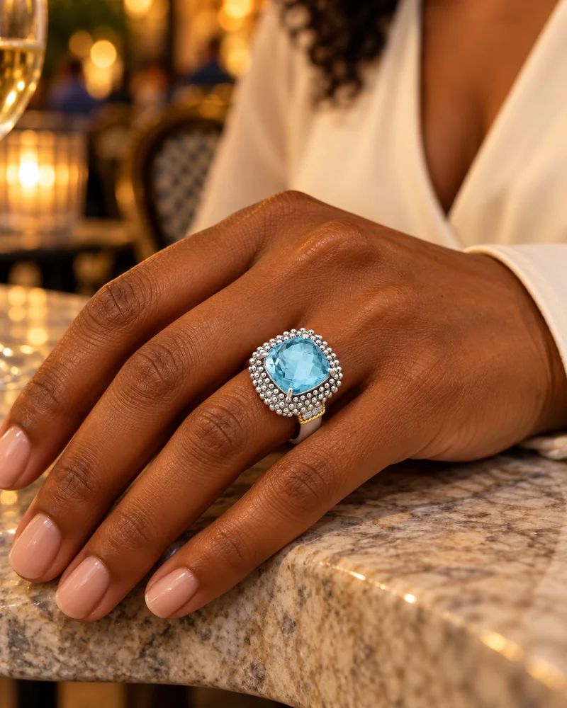 Blue topaz two-tone popcorn ring worn naturally in an evening look