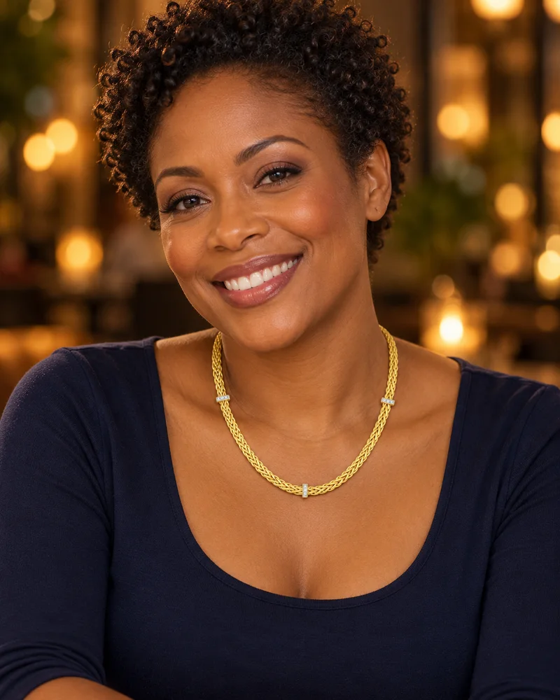 Woven gold diamond-accent necklace worn naturally in an evening look